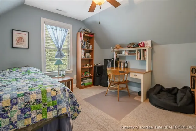 a bedroom with furniture and a window