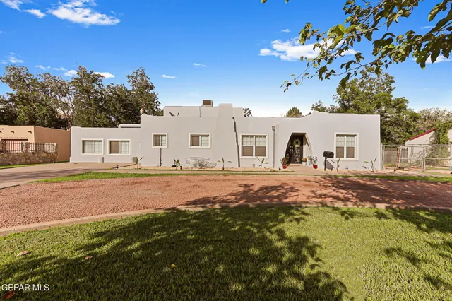 a house with swimming pool in front of it