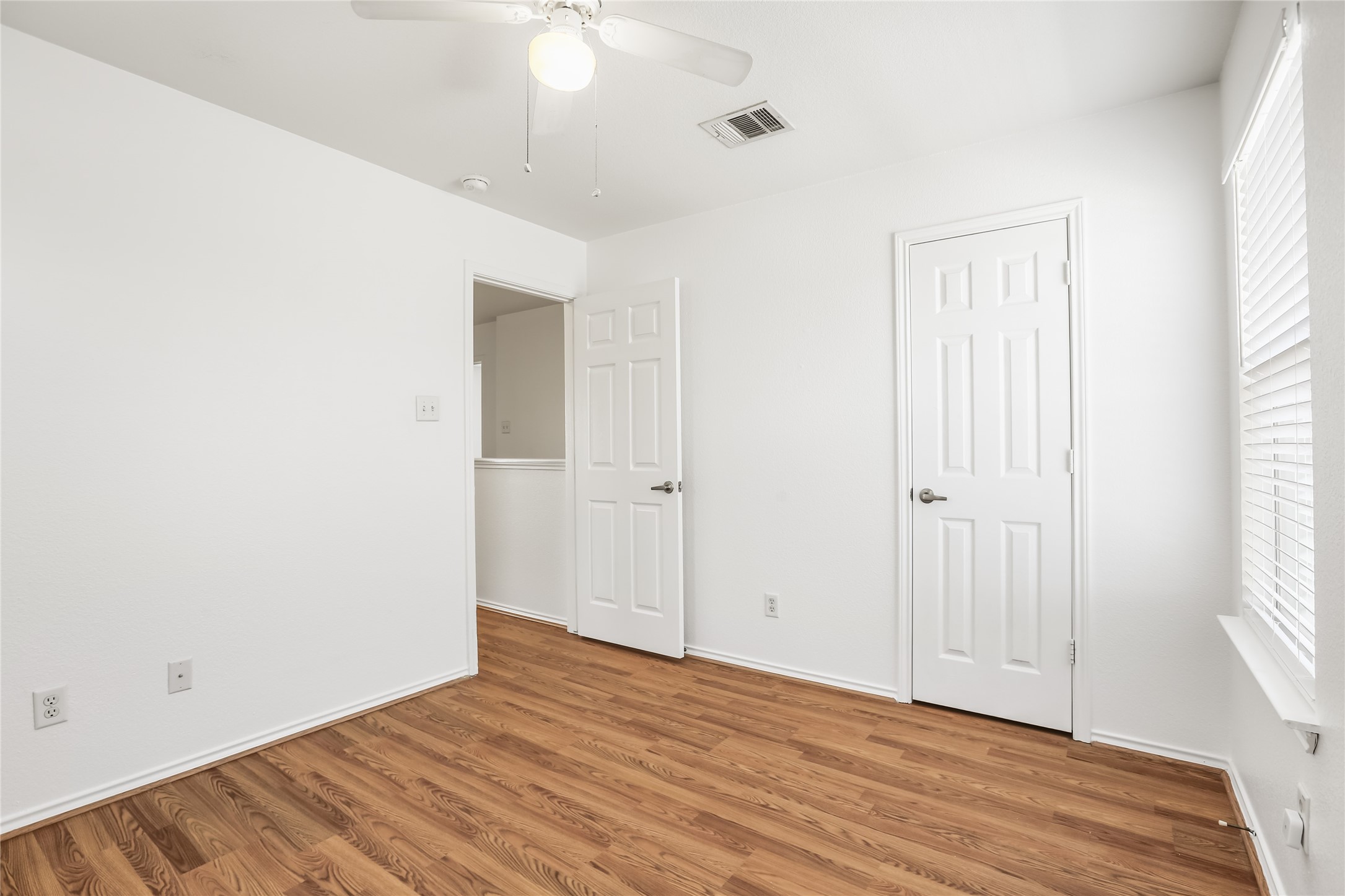 2010 Ashberry Trail Georgetown, TX 78626 - Photo 20 of 24 Unfurnished bedroom with wood finished floors and ceiling fan