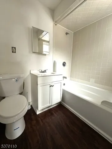 a bathroom with a toilet a sink and bathtub