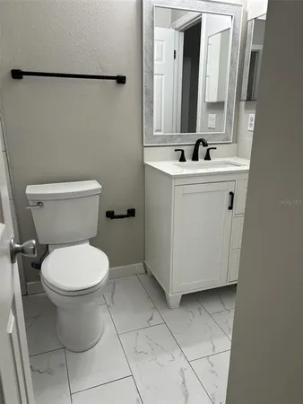 a bathroom with a sink and a toilet