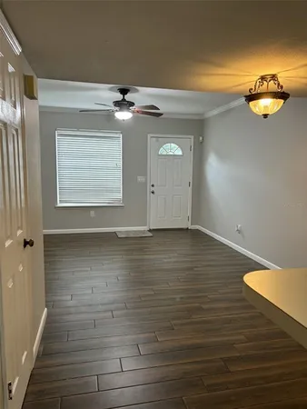 a view of a room with wooden floor