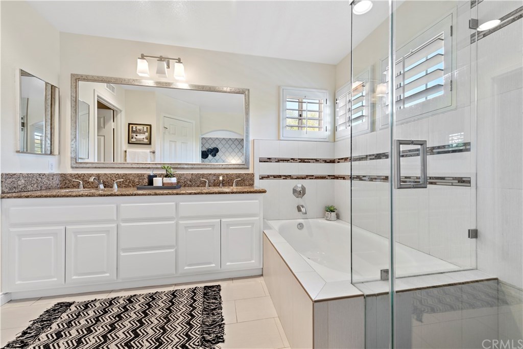 43 Cassis Dana Point, CA 92629 - Photo 11 of 41 a spacious bathroom with sinks mirror and