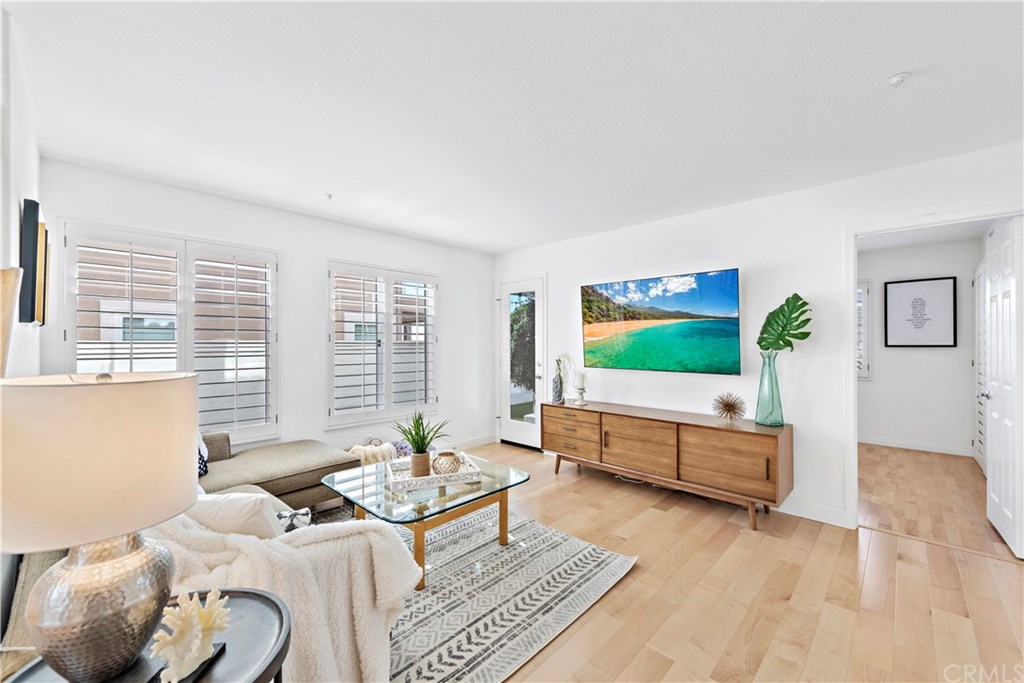 43 Cassis Dana Point, CA 92629 - Photo 12 of 41 a living room with furniture and a flat screen tv