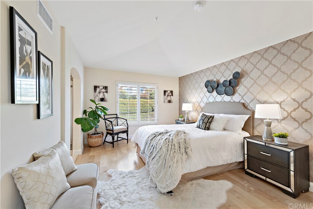 43 Cassis Dana Point, CA 92629 - Photo 8 of 41 a bed room with a bed and potted plant