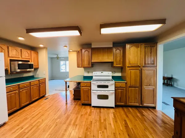 a kitchen with stainless steel appliances a stove a sink and a refrigerator