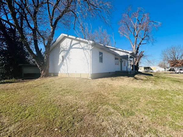 a view of a backyard of the house