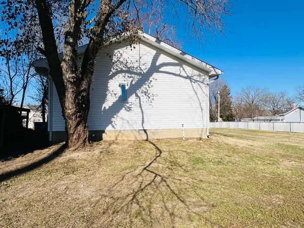 a view of a yard with a tree