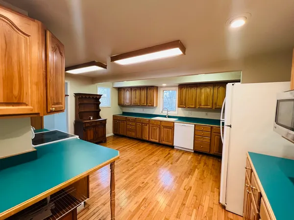 a kitchen with stainless steel appliances a sink and a stove