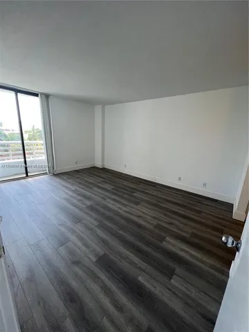 a view of hallway with wooden floor