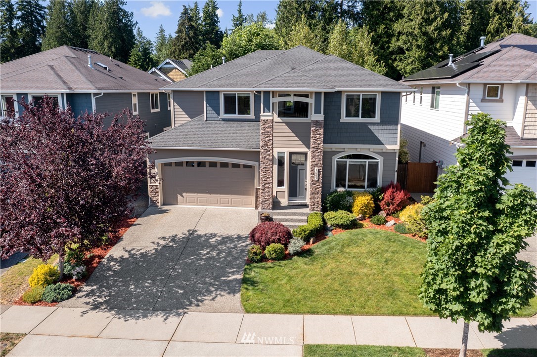 3603 222nd Place Southeast Bothell, WA 98021 - Photo 1 of 40 a front view of a house with garden