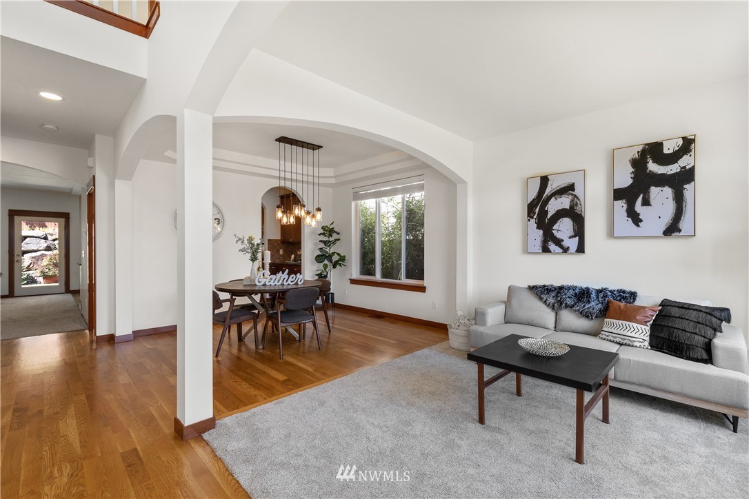 3603 222nd Place Southeast Bothell, WA 98021 - Photo 2 of 40 a living room with furniture and wooden floor