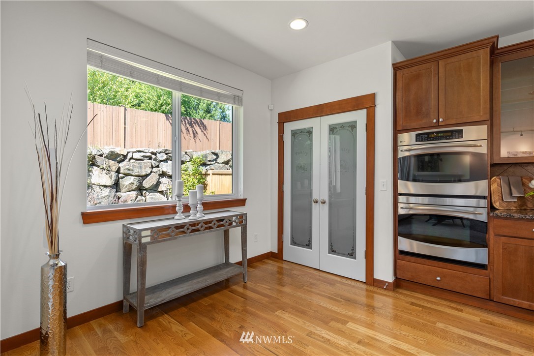 3603 222nd Place Southeast Bothell, WA 98021 - Photo 13 of 40 a kitchen with granite countertop a stove and a refrigerator