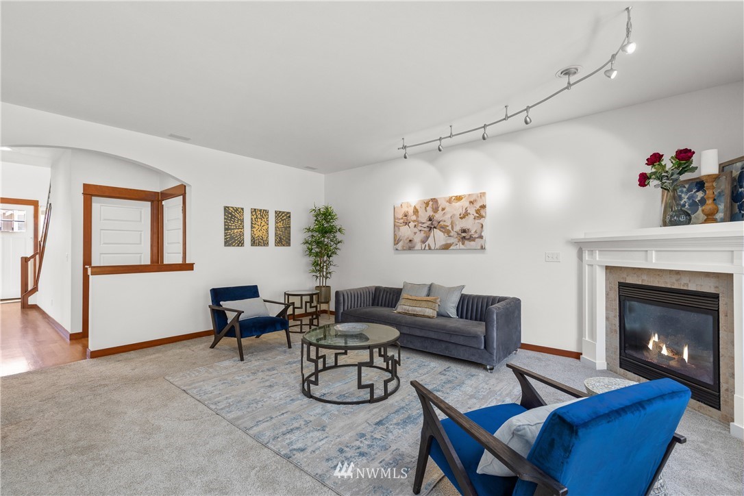 3603 222nd Place Southeast Bothell, WA 98021 - Photo 14 of 40 a living room with furniture and a fireplace