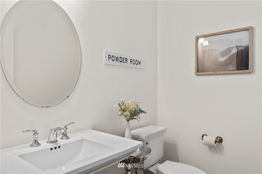 3603 222nd Place Southeast Bothell, WA 98021 - Photo 17 of 40 a bathroom with a toilet a sink and mirror