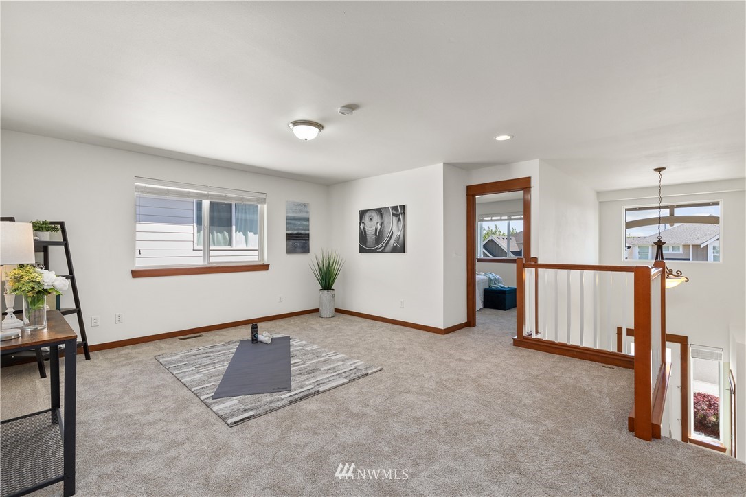 3603 222nd Place Southeast Bothell, WA 98021 - Photo 20 of 40 a living room with furniture and a window