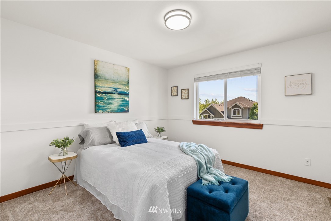 3603 222nd Place Southeast Bothell, WA 98021 - Photo 28 of 40 a bedroom with a bed and a painting on the wall