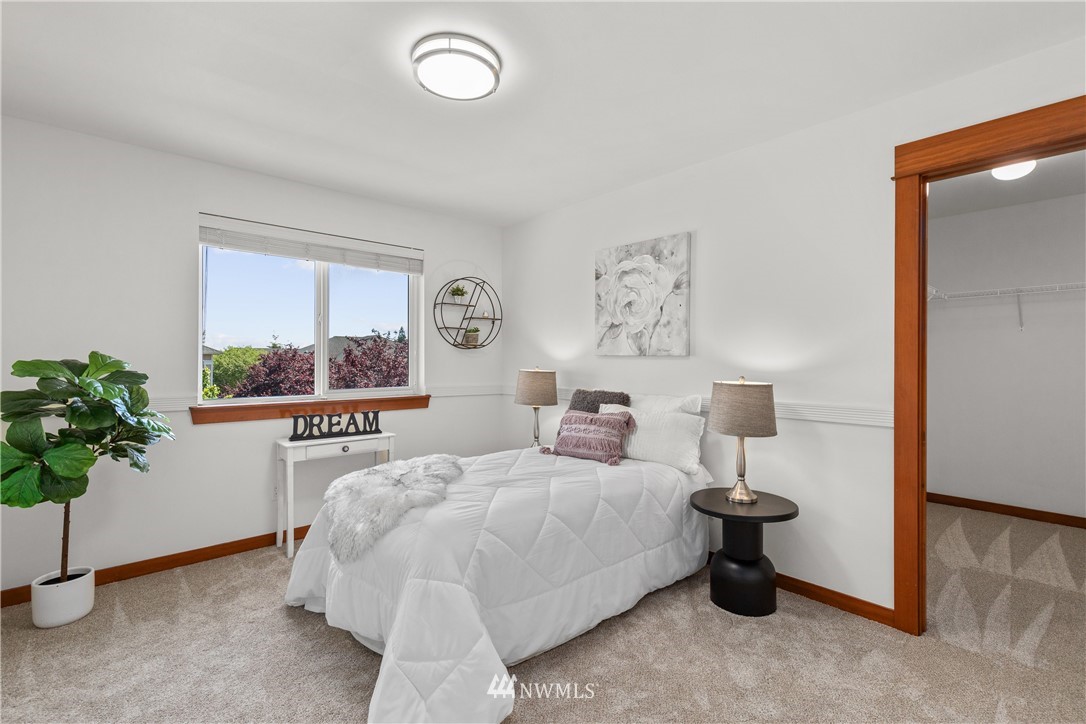 3603 222nd Place Southeast Bothell, WA 98021 - Photo 30 of 40 a bedroom with a bed and a potted plant