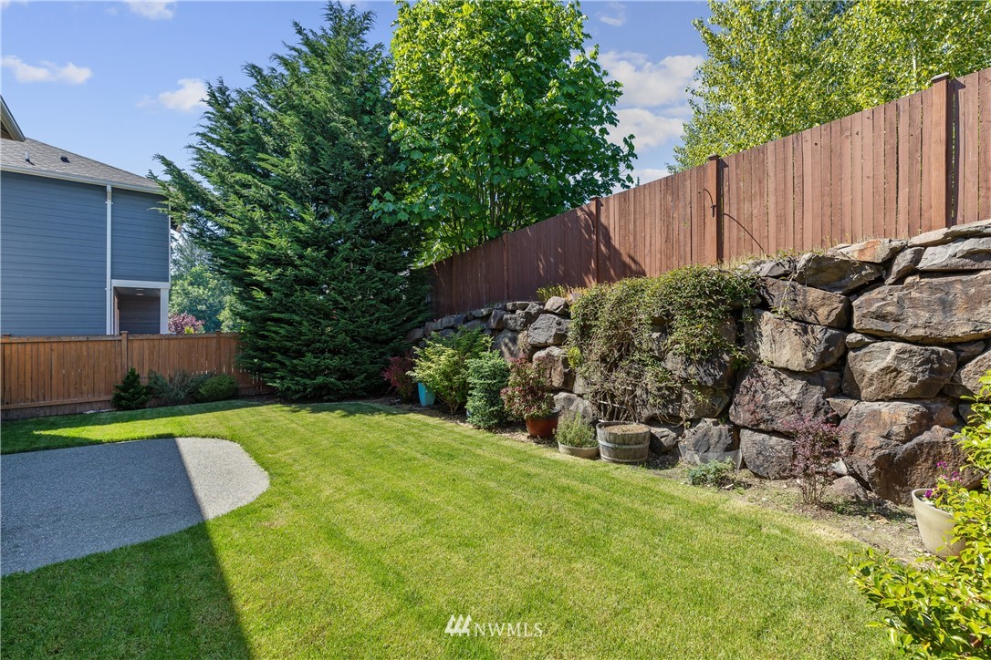 3603 222nd Place Southeast Bothell, WA 98021 - Photo 39 of 40 a view of a backyard with plants and large trees
