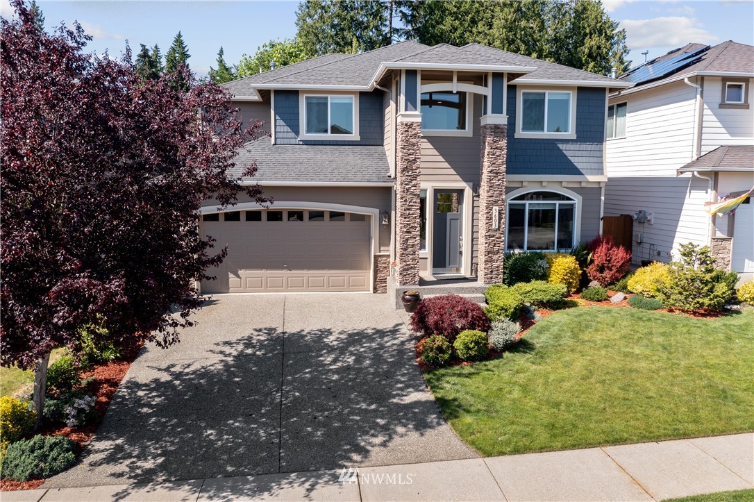 3603 222nd Place Southeast Bothell, WA 98021 - Photo 40 of 40 a front view of a house with a yard