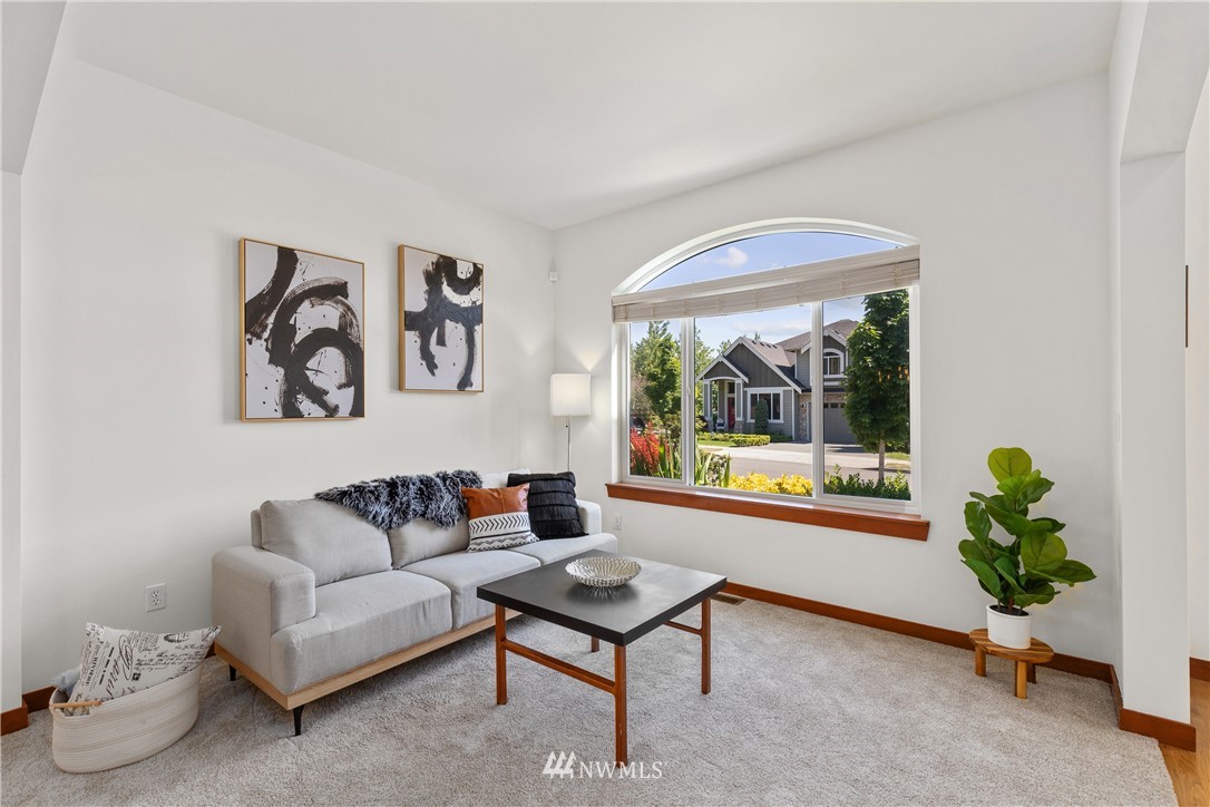 3603 222nd Place Southeast Bothell, WA 98021 - Photo 5 of 40 a living room with furniture and a window with outer view