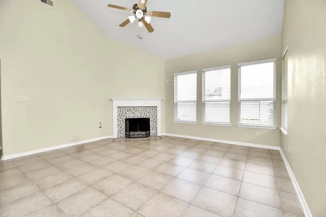 a view of an empty room with a fireplace