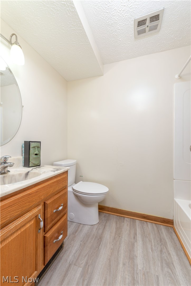2740 Ranfield Road Mogadore, OH 44260 - Photo 22 of 33 Full bath # 3 on level 3 with all bedrooms.
Laminate flooring.