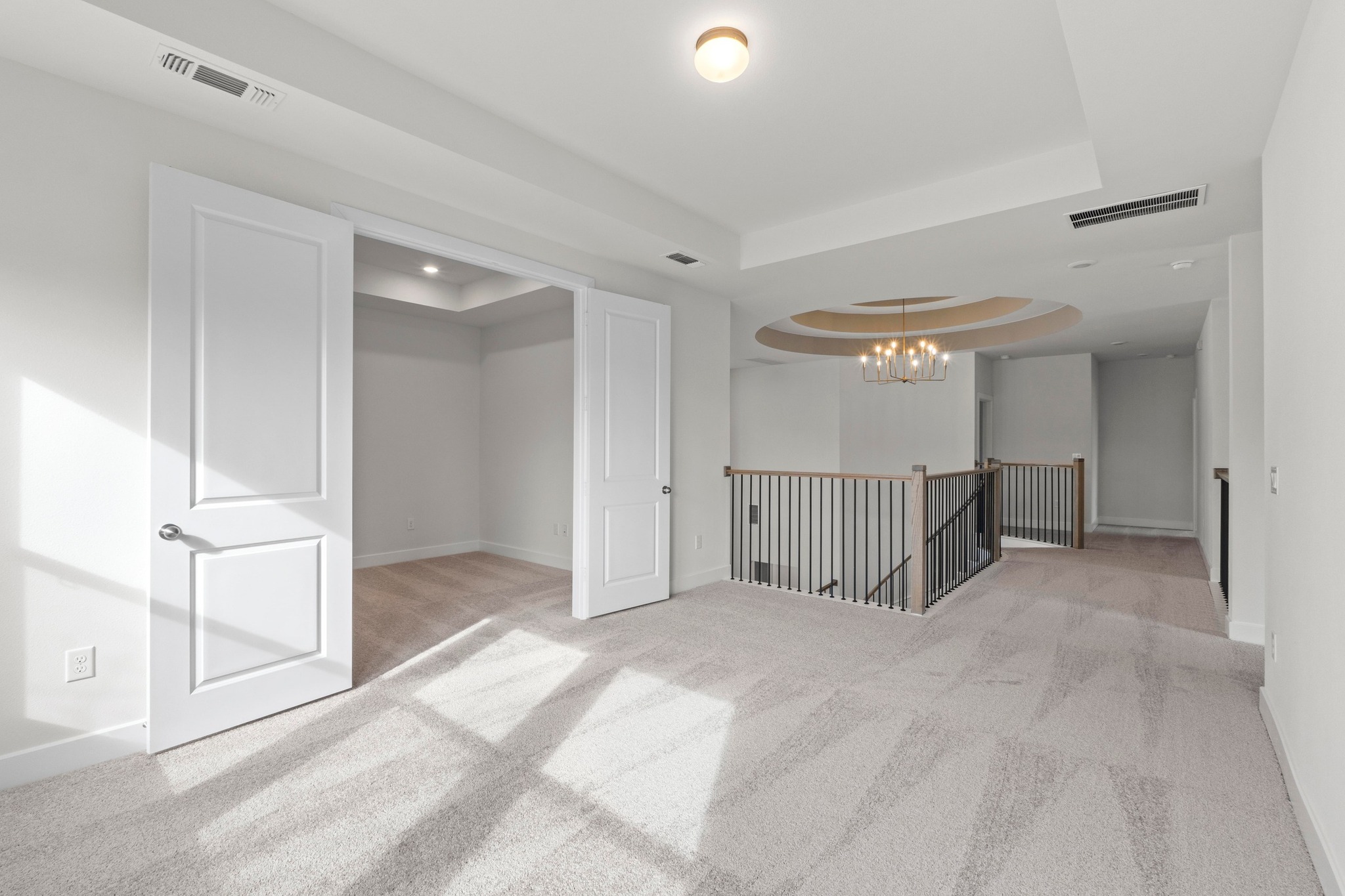 604 Lightstone Drive Georgetown, TX 78633 - Photo 20 of 39 a view of a room with stairs and a chandelier fan