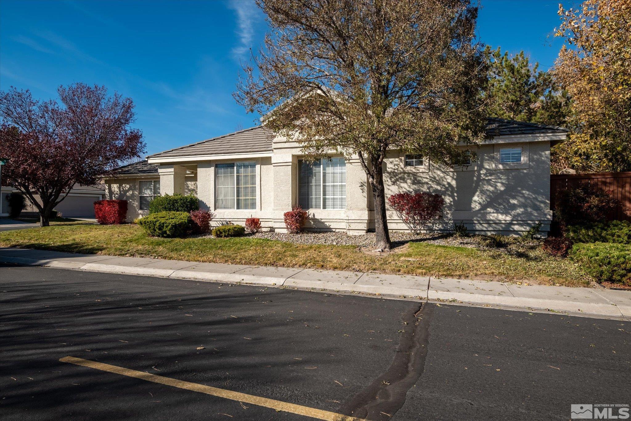 1197 Tule Drive Reno, NV 89521 - Photo 2 of 30 a front view of a house with a yard