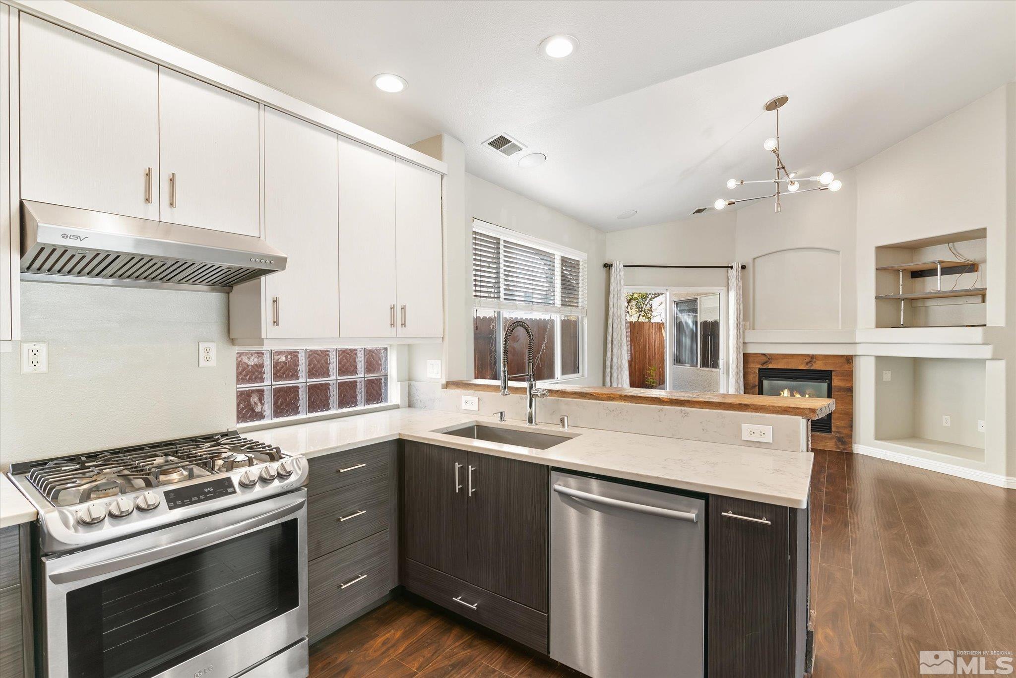 1197 Tule Drive Reno, NV 89521 - Photo 10 of 30 a kitchen with a stove and a sink