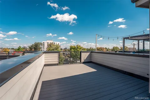 a view of a living room and kitchen with kitchen island