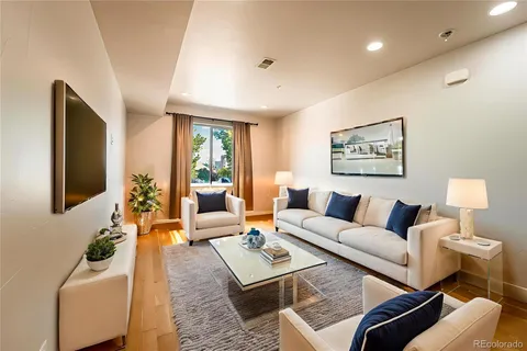 a living room with furniture and a lamp