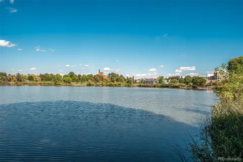 a view of a lake with houses in the background
