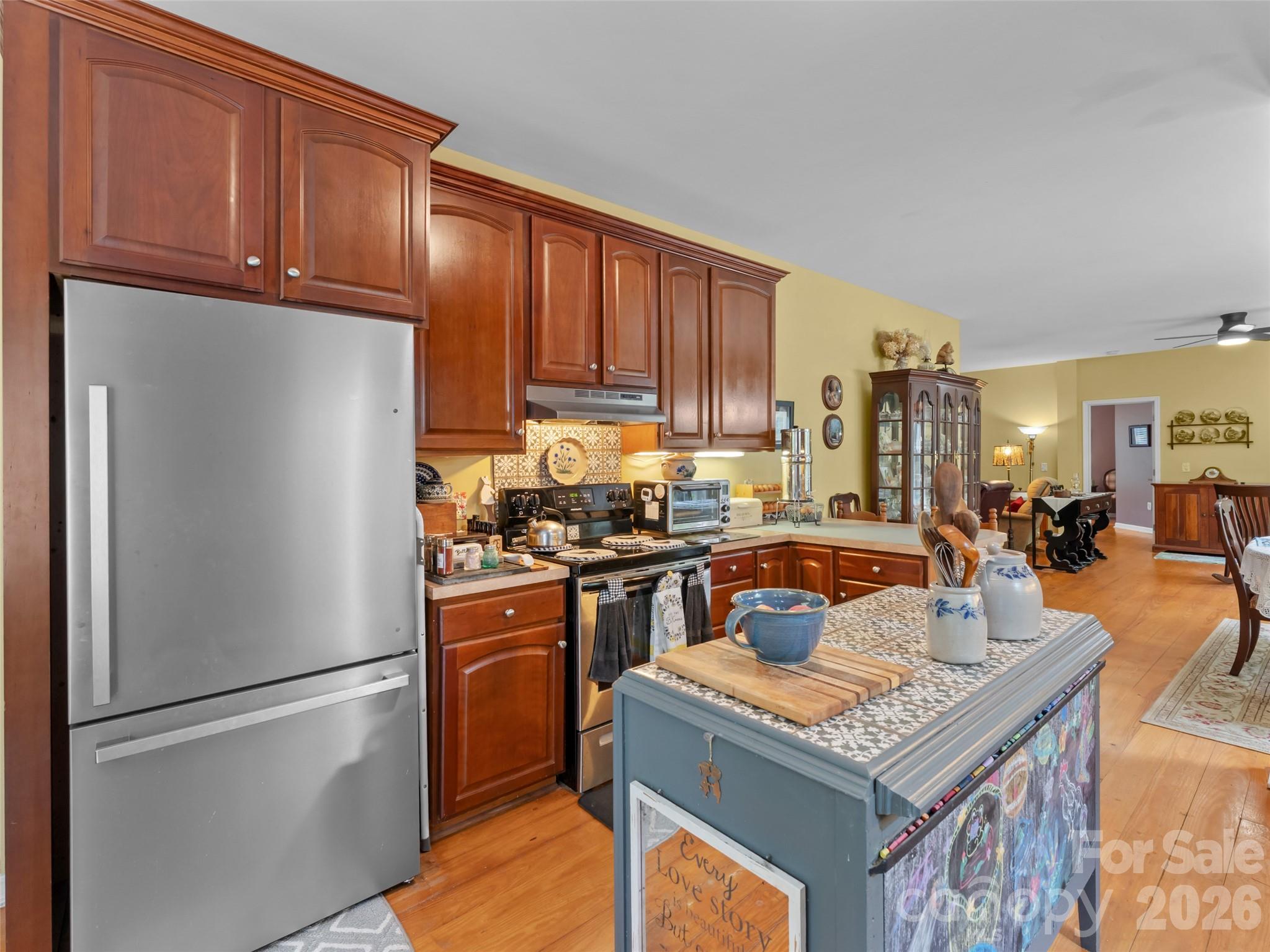 103 Old Southside Road Saluda, NC 28773 - Photo 18 of 48 a kitchen with a refrigerator a stove a sink and a cabinets
