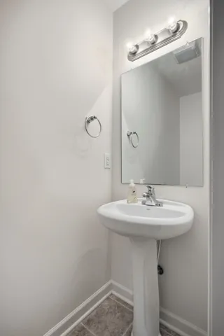 a bathroom with a sink a mirror and a toilet