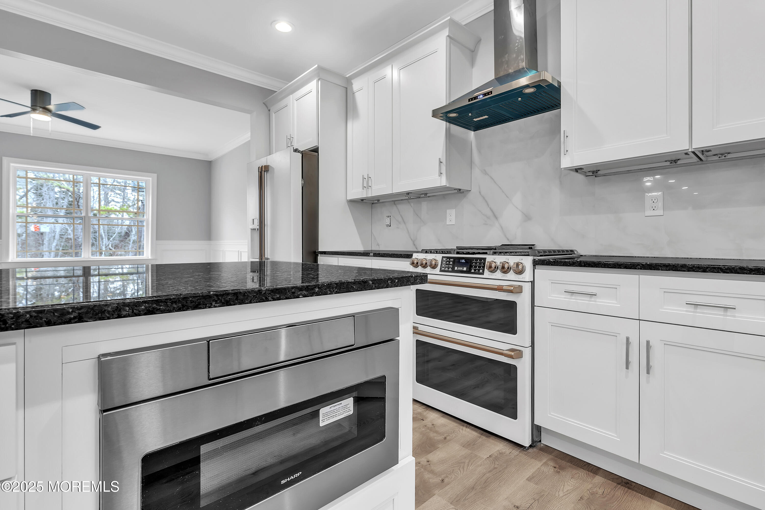 217 Nantucket Road Forked River, NJ 08731 - Photo 11 of 38 a kitchen with stainless steel appliances granite countertop a sink and cabinets