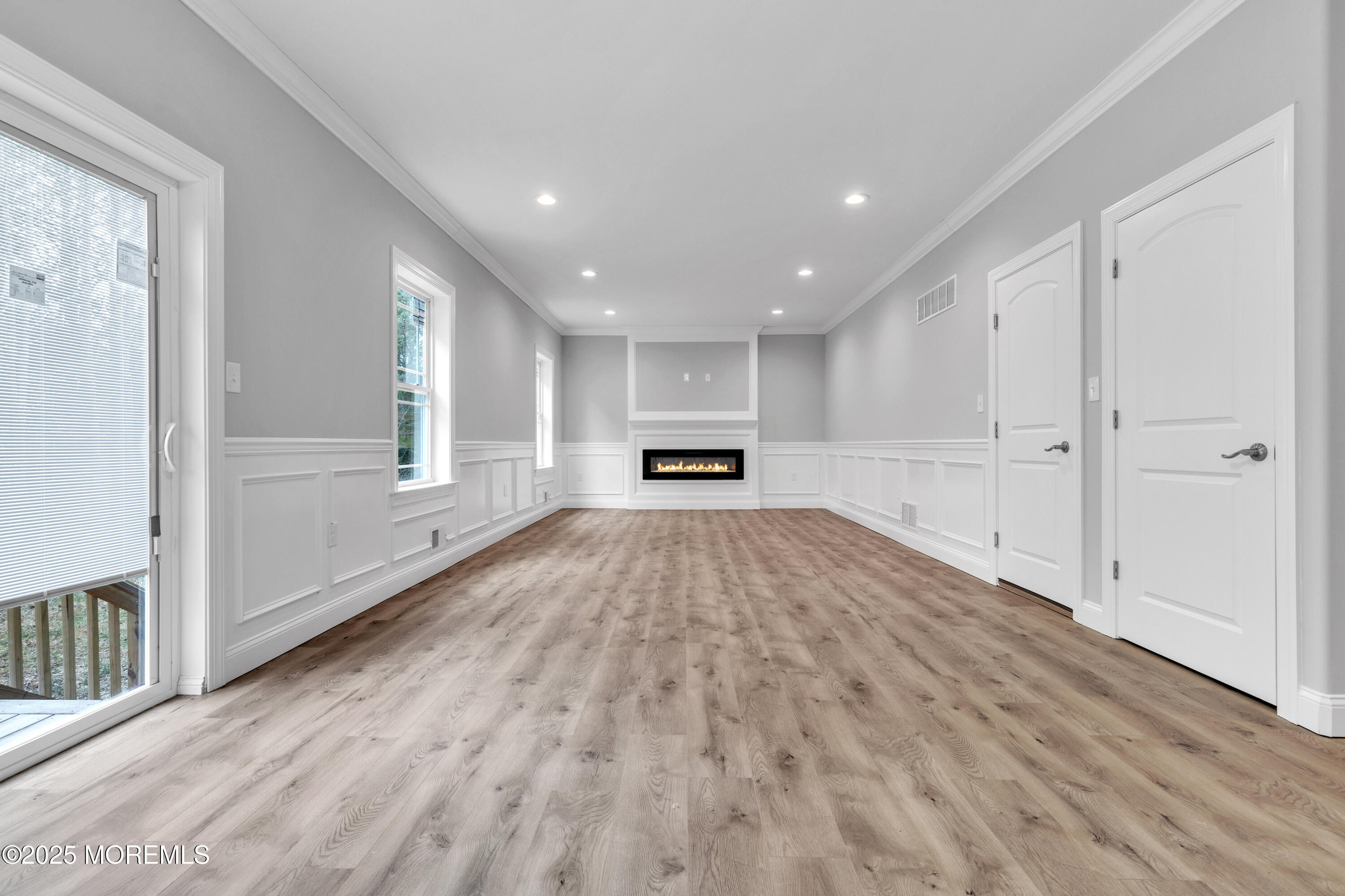 217 Nantucket Road Forked River, NJ 08731 - Photo 14 of 38 a view of an empty room with wooden floor and a window