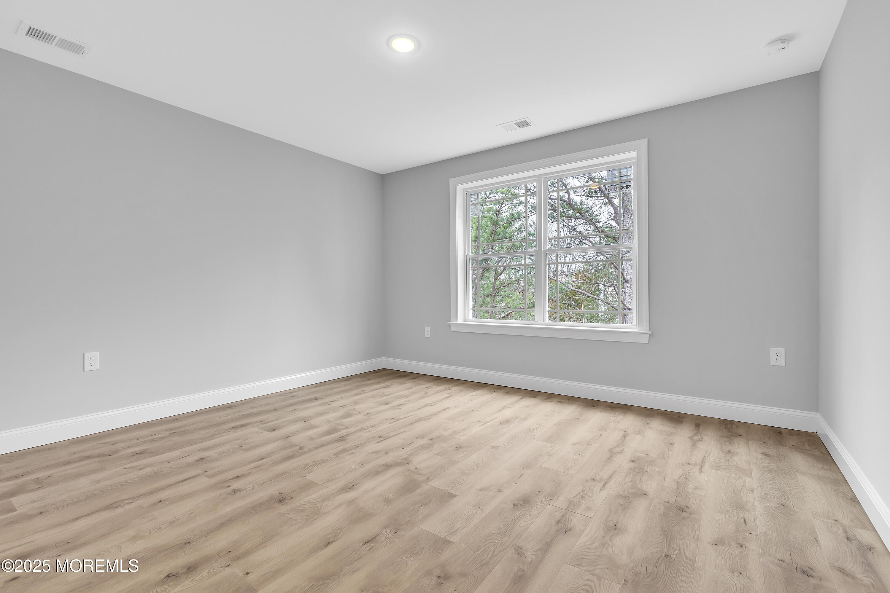 217 Nantucket Road Forked River, NJ 08731 - Photo 17 of 38 wooden floor in an empty room with a window