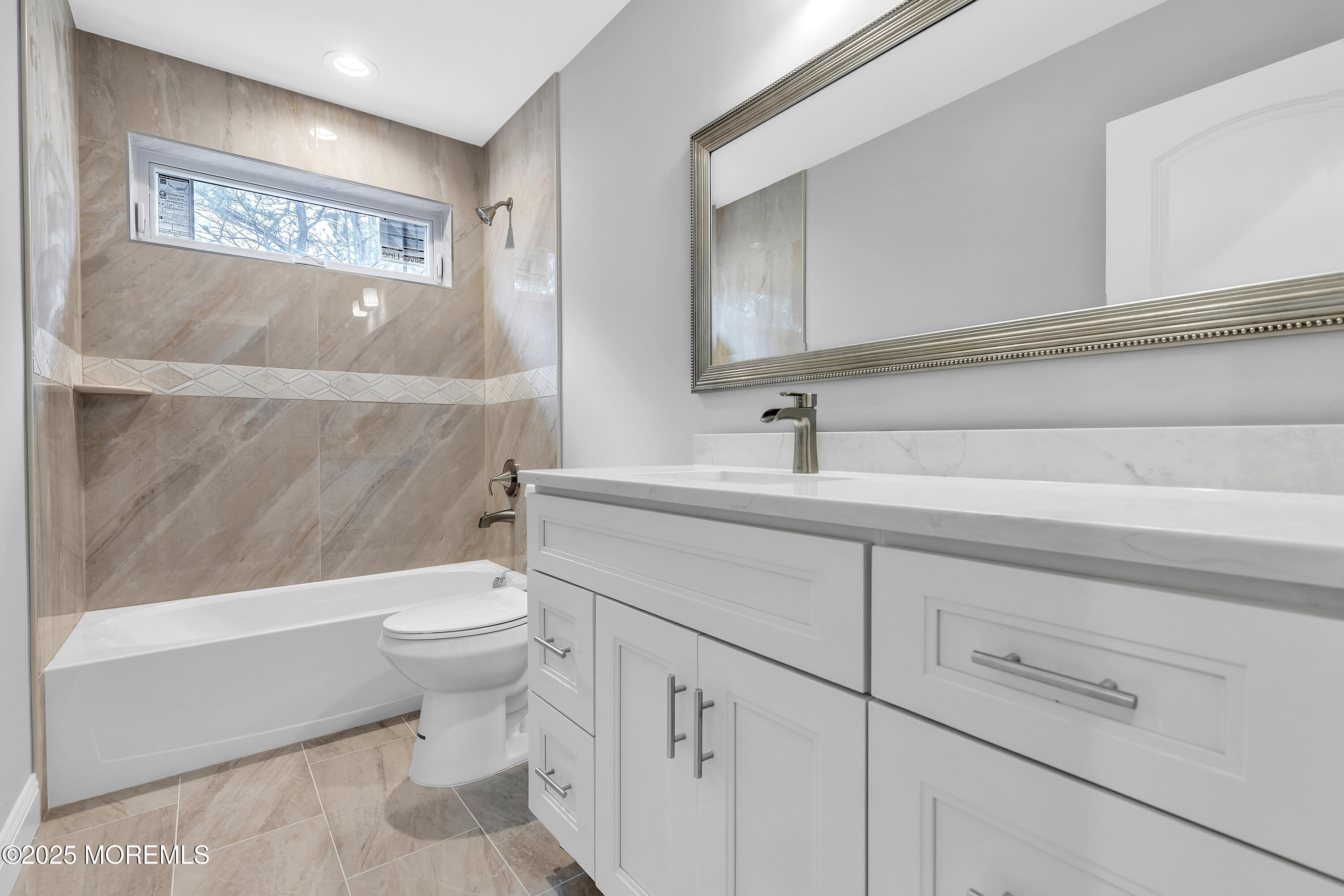 217 Nantucket Road Forked River, NJ 08731 - Photo 20 of 38 a bathroom with a sink a toilet and a bathtub