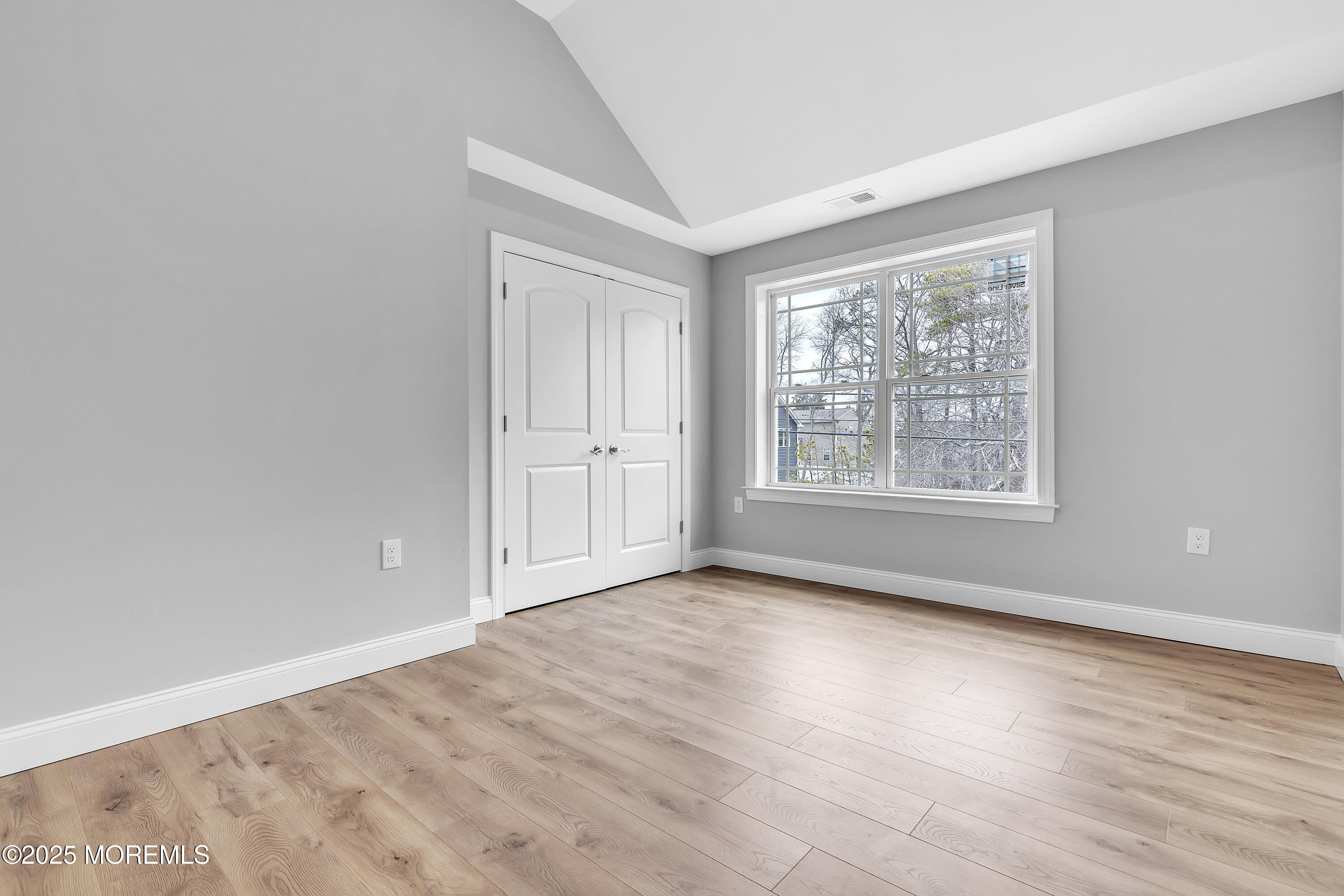 217 Nantucket Road Forked River, NJ 08731 - Photo 24 of 38 an empty room with wooden floor and windows