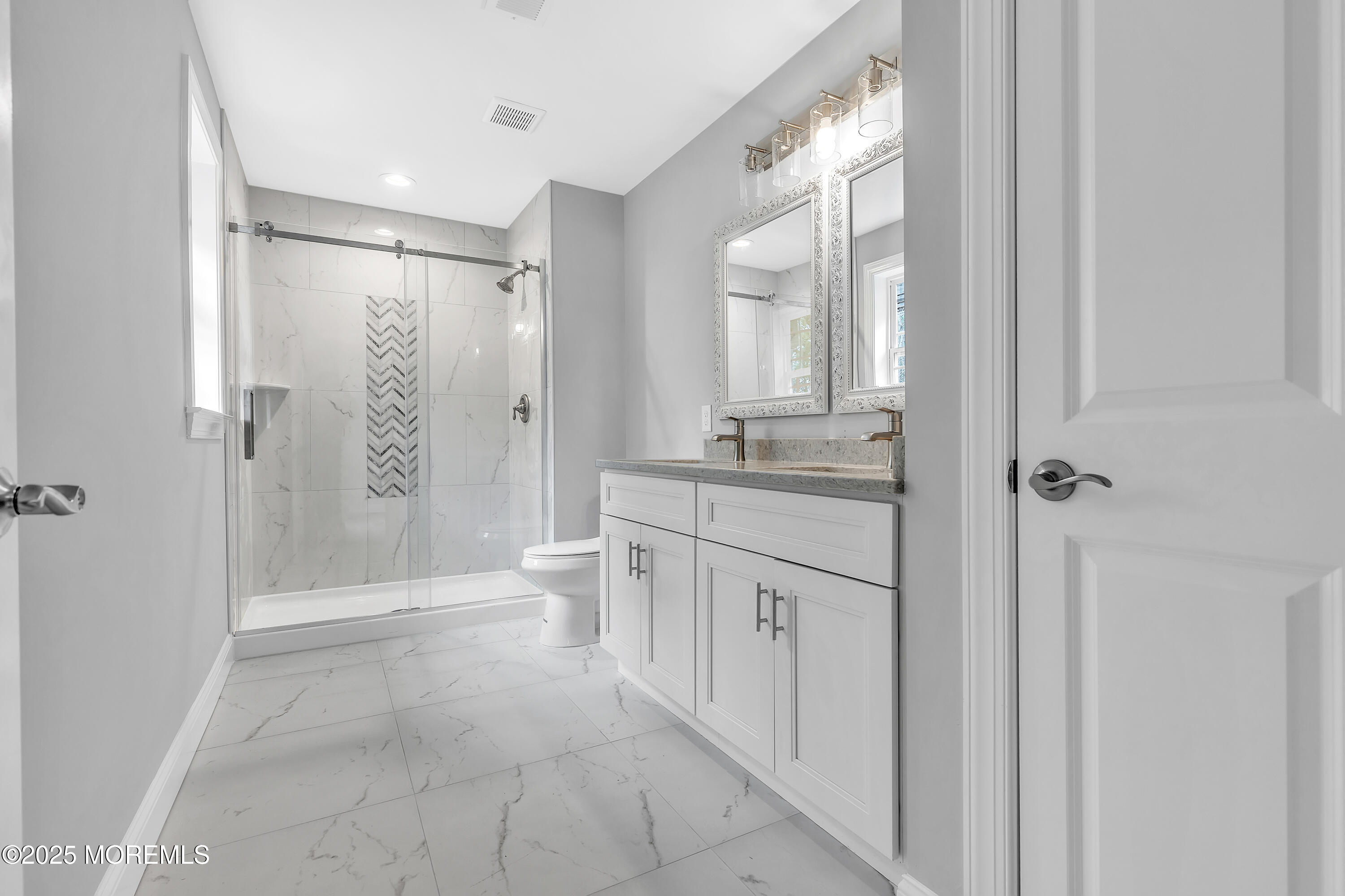 217 Nantucket Road Forked River, NJ 08731 - Photo 27 of 38 a bathroom with a granite countertop sink mirror and a shower