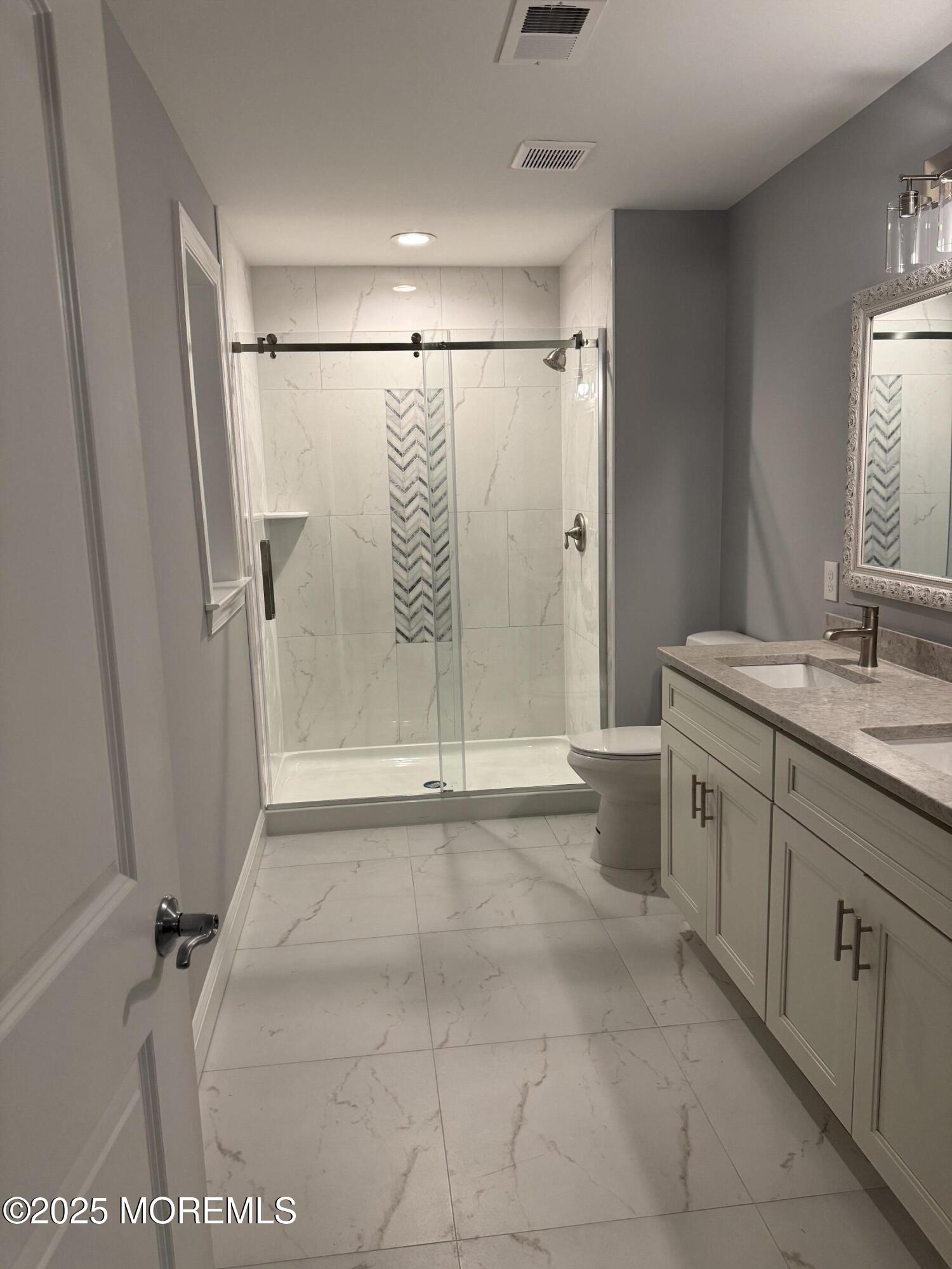 217 Nantucket Road Forked River, NJ 08731 - Photo 28 of 38 a bathroom with a shower sink and mirror