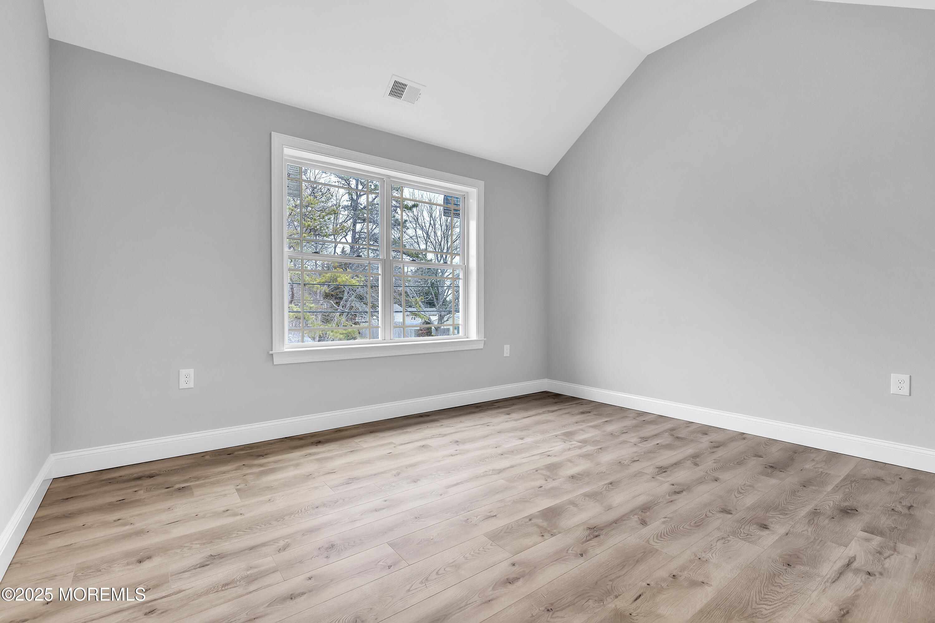 217 Nantucket Road Forked River, NJ 08731 - Photo 29 of 38 an empty room with wooden floor and windows