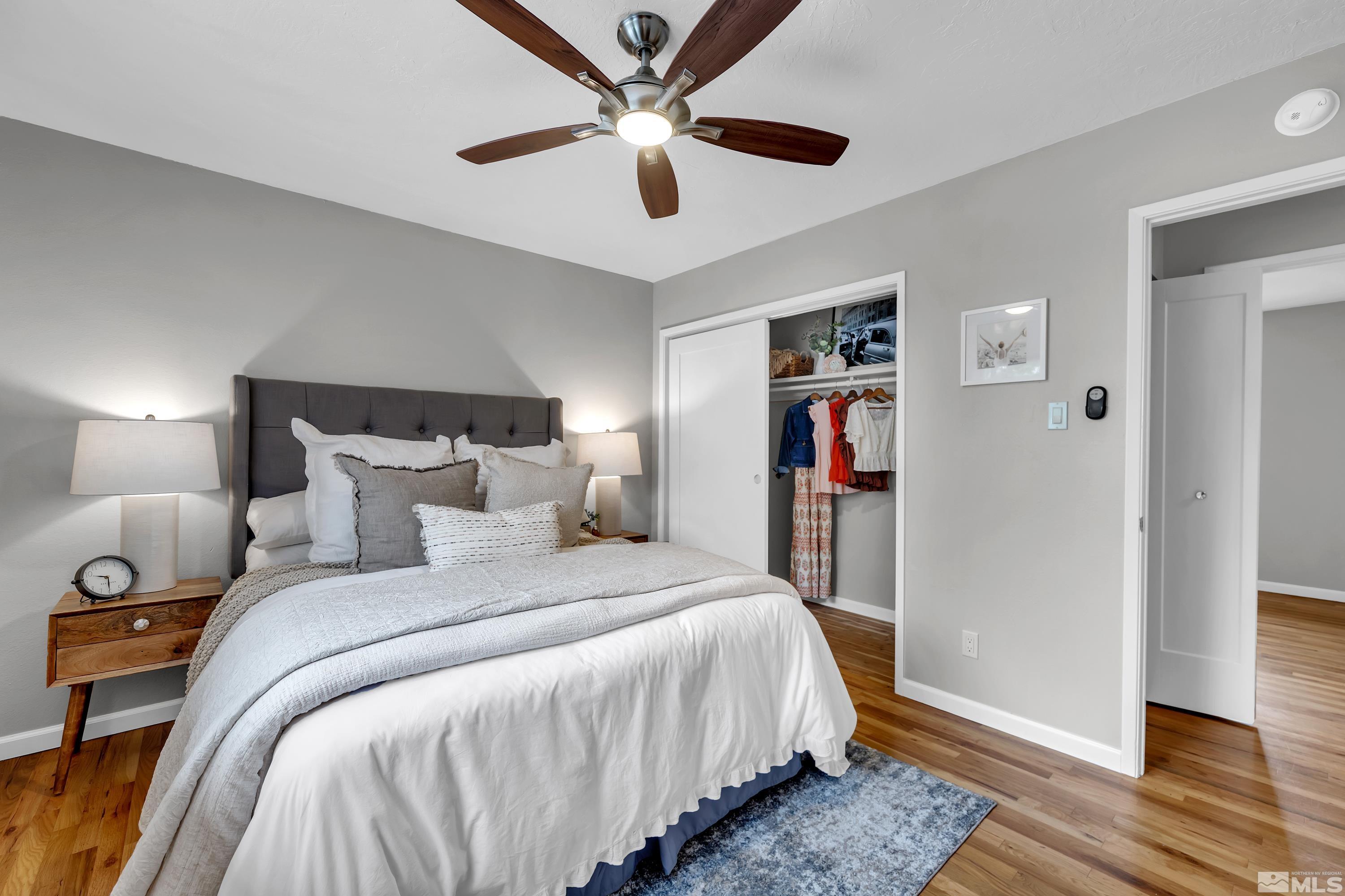 1415 Ebbetts Drive Reno, NV 89503 - Photo 13 of 36 a bedroom with bed and a chandelier