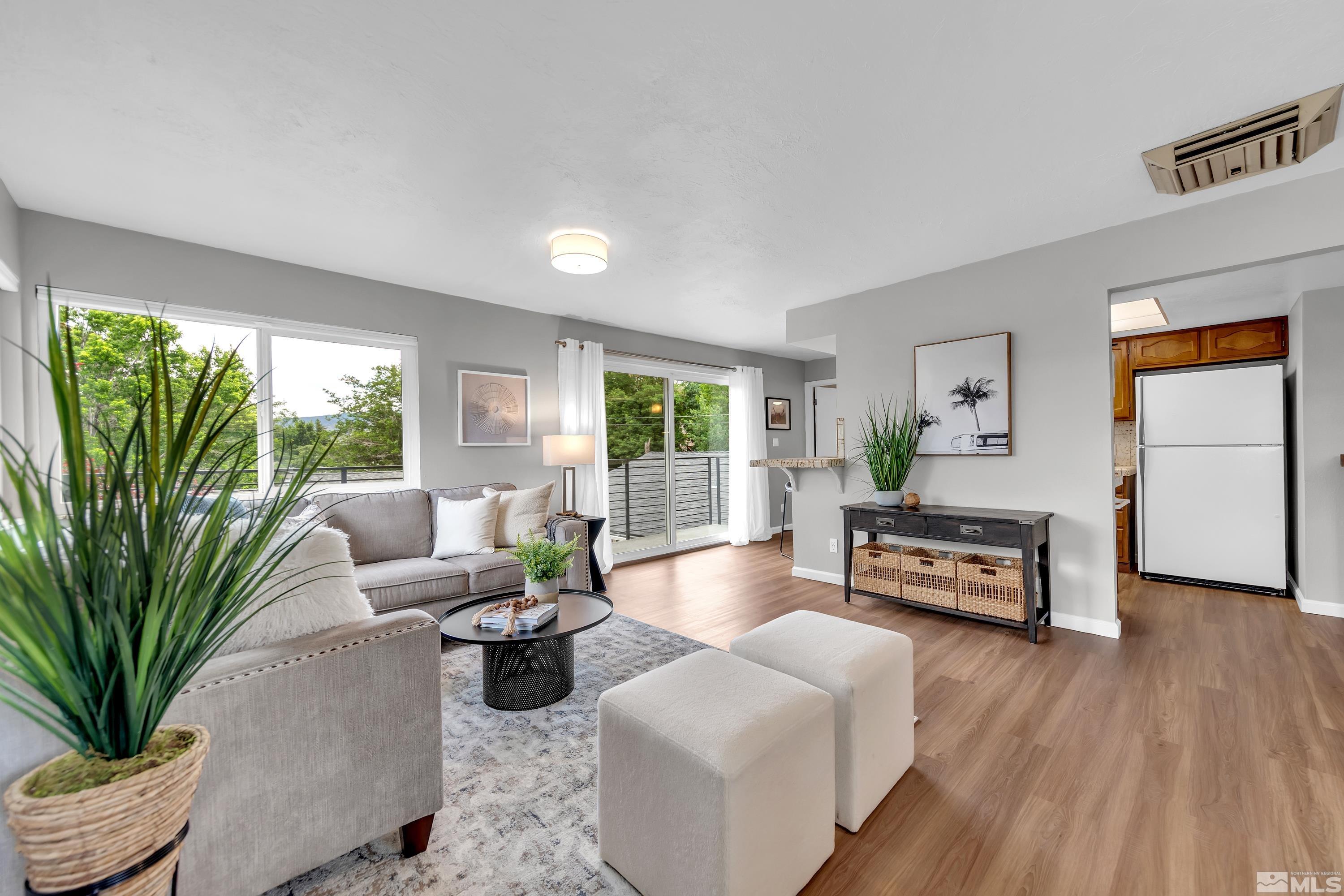 1415 Ebbetts Drive Reno, NV 89503 - Photo 19 of 36 a living room with furniture and a wooden floor