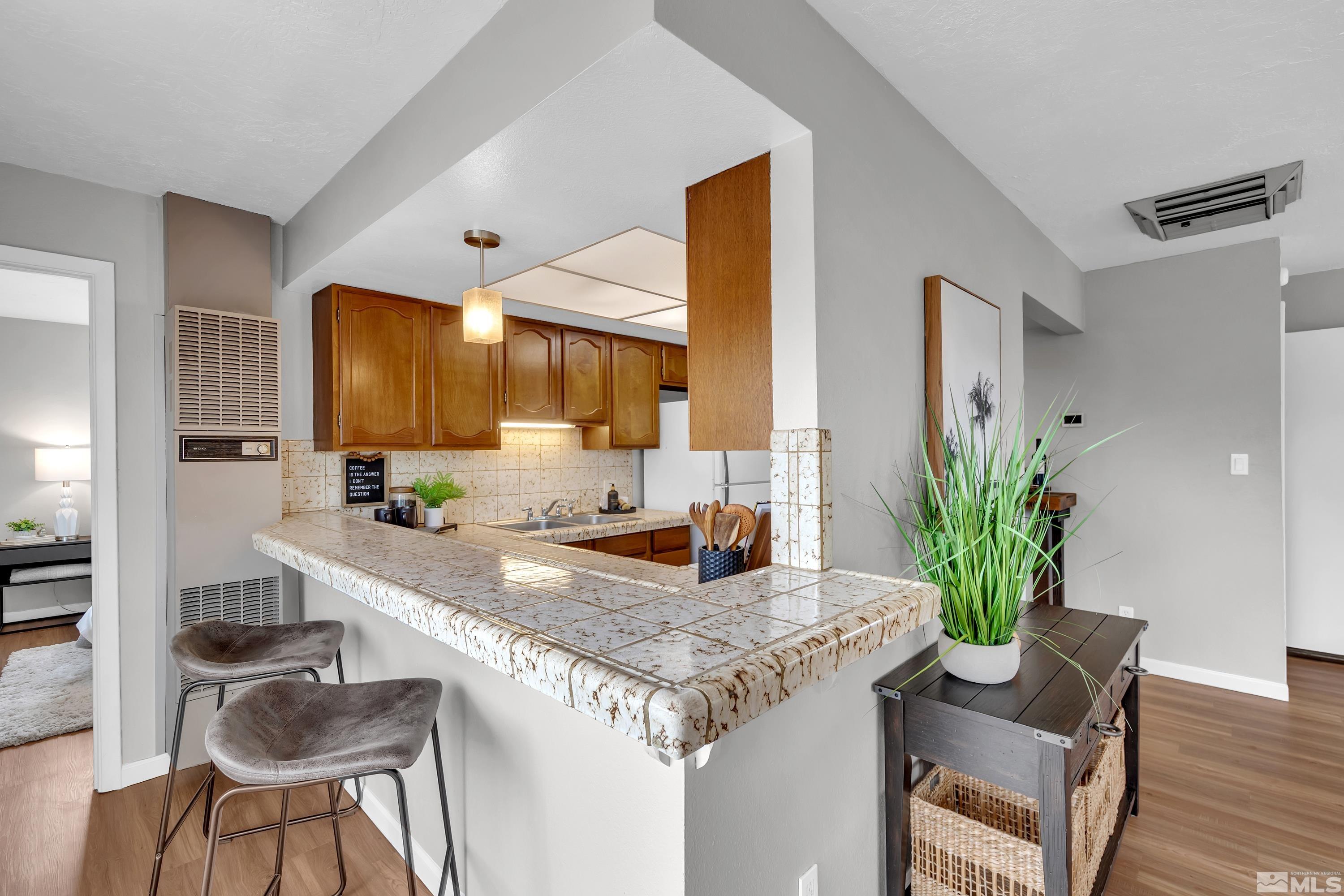 1415 Ebbetts Drive Reno, NV 89503 - Photo 23 of 36 a kitchen with a table and chairs in it
