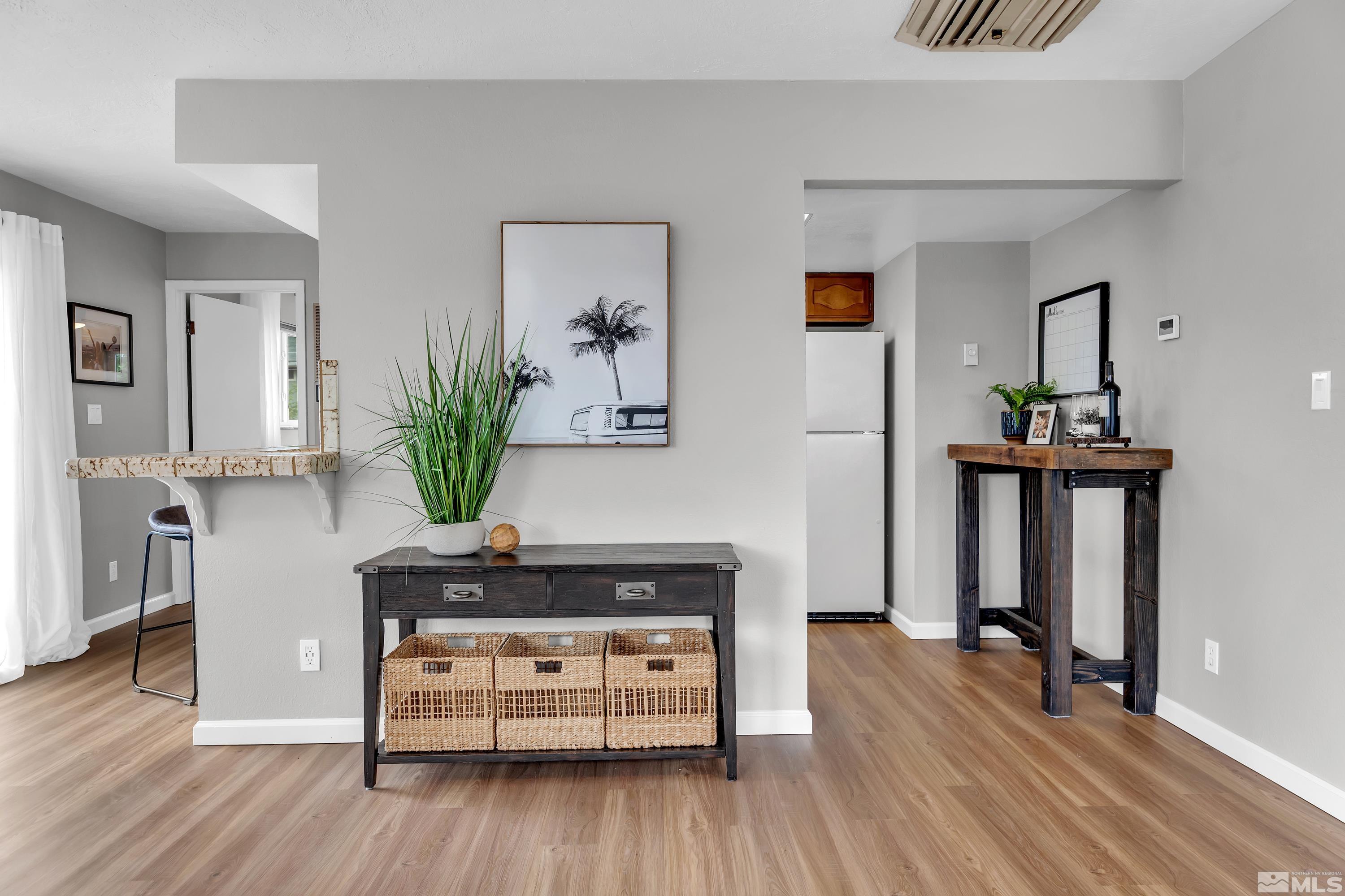 1415 Ebbetts Drive Reno, NV 89503 - Photo 25 of 36 a living room with furniture and a wooden floor