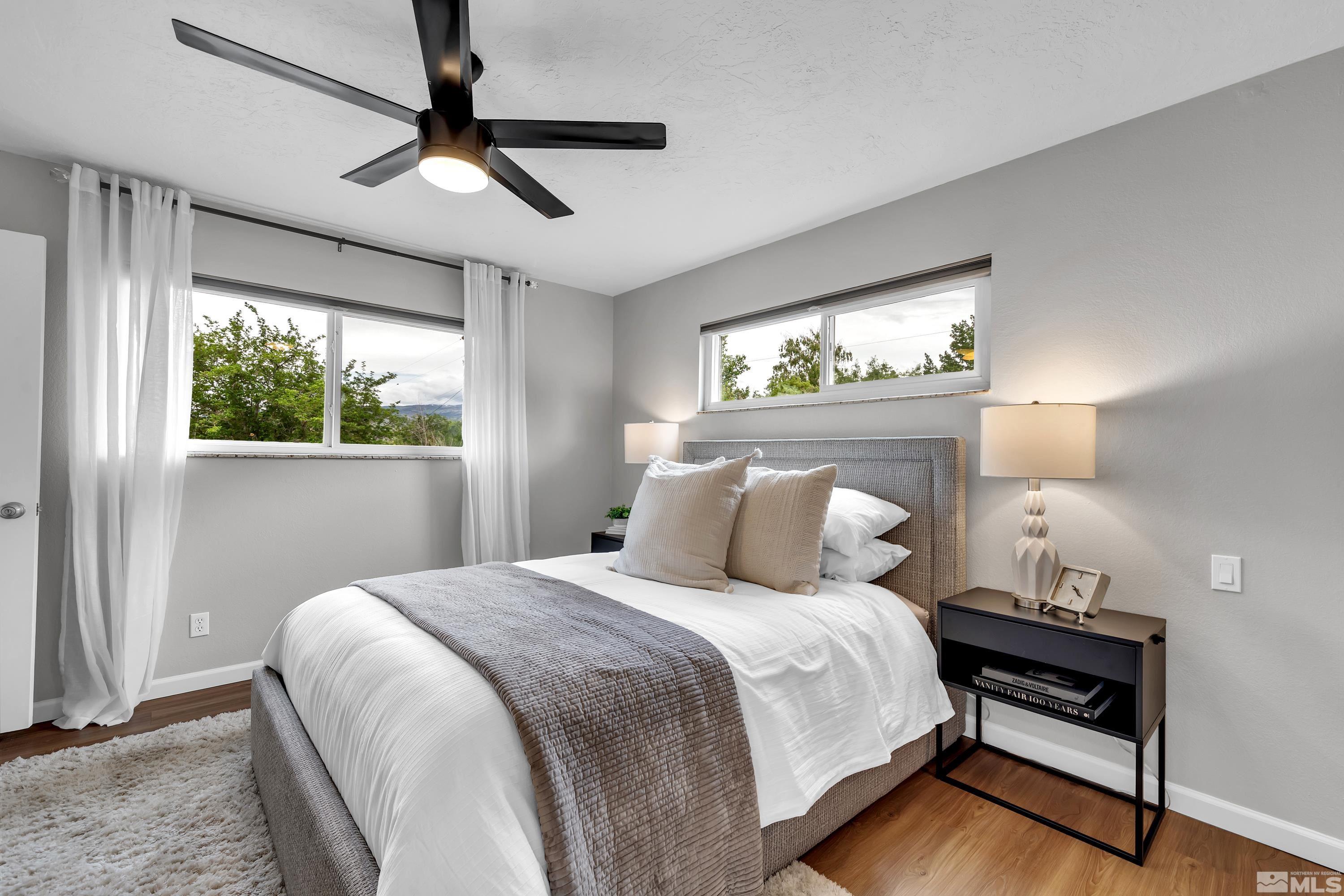 1415 Ebbetts Drive Reno, NV 89503 - Photo 29 of 36 a bedroom with a bed and a window