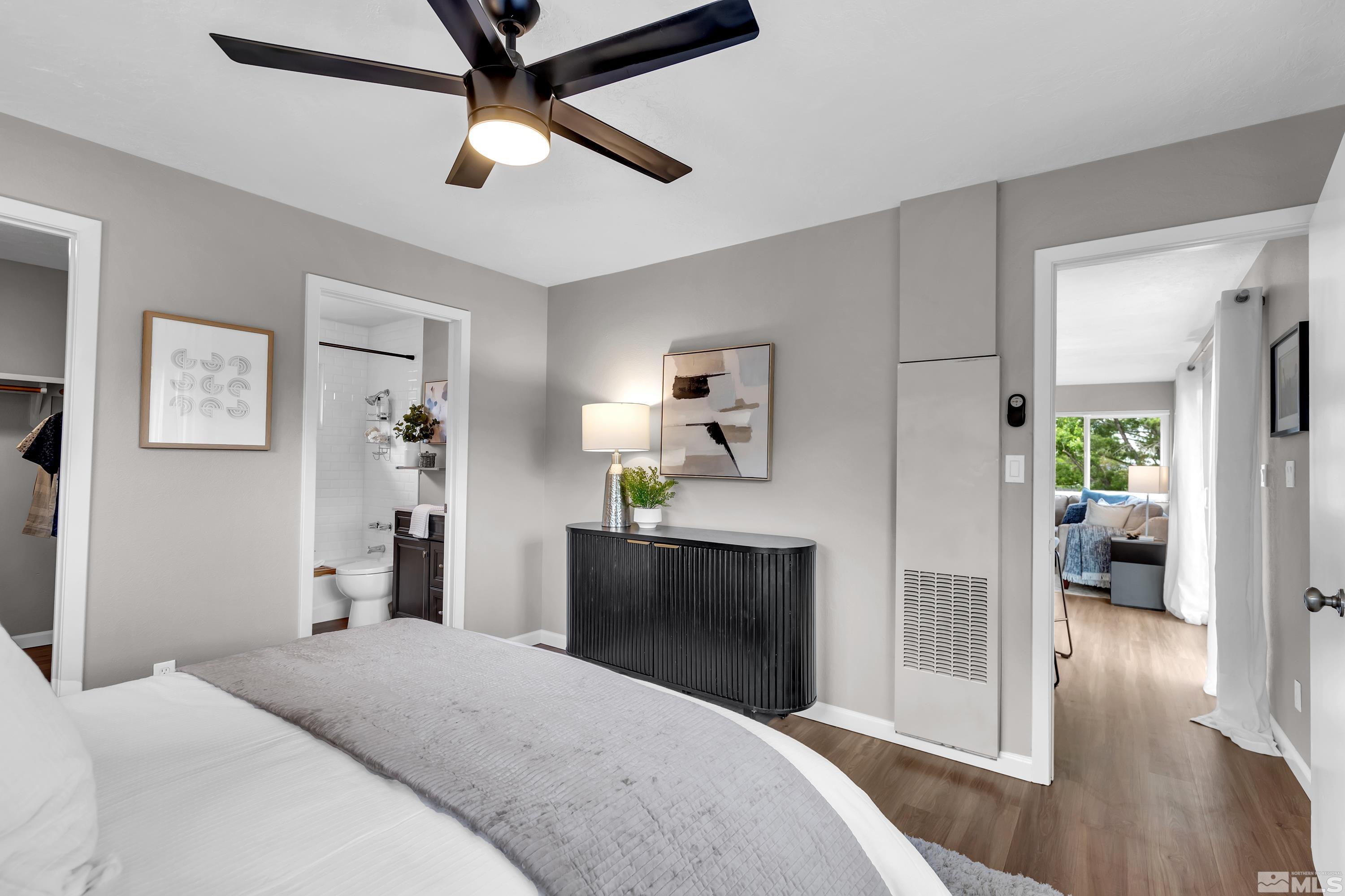 1415 Ebbetts Drive Reno, NV 89503 - Photo 30 of 36 a bedroom with a bed and a chandelier