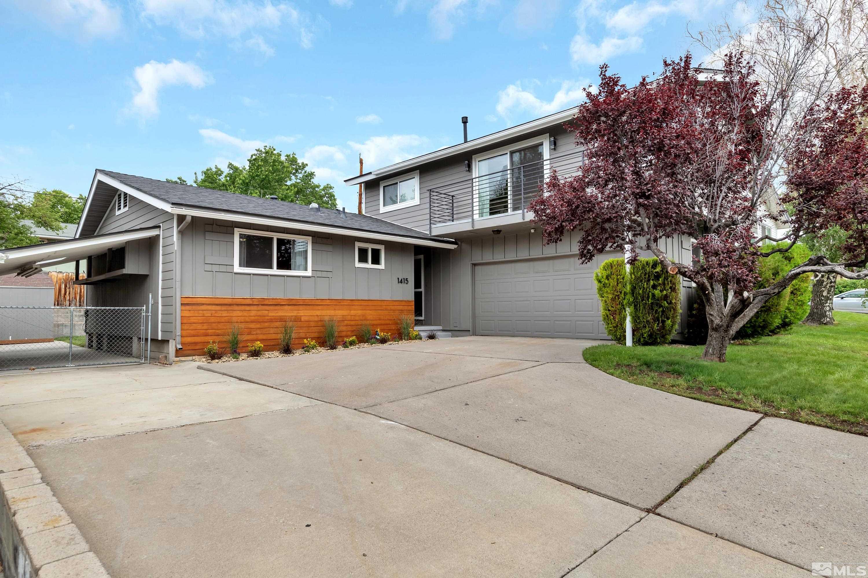 1415 Ebbetts Drive Reno, NV 89503 - Photo 3 of 36 a front view of house with yard and trees in the background